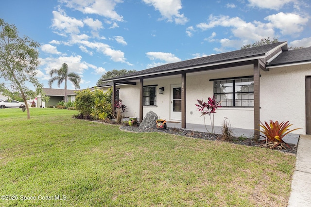 813 Laurel Dr, Rockledge, FL 32955 - view of front of house with a front yard, stucco siding, a porch, and roof with shingles