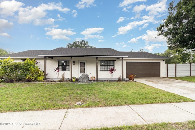 813 Laurel Dr, Rockledge, FL 32955 - single story home with stucco siding, an attached garage, driveway, and covered porch