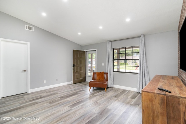 813 Laurel Dr, Rockledge, FL 32955 - sitting room featuring vaulted ceiling, light wood-style floors, recessed lighting, and baseboards