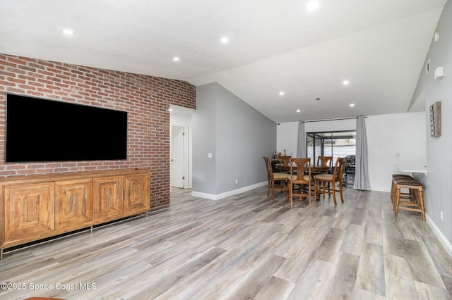 813 Laurel Dr, Rockledge, FL 32955 - dining room with vaulted ceiling, baseboards, light wood-type flooring, and recessed lighting