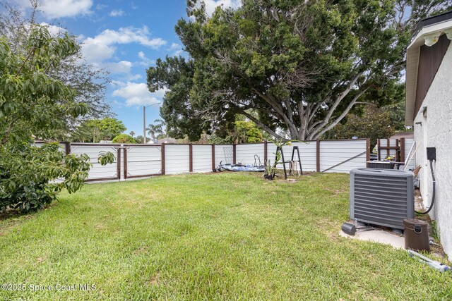 813 Laurel Dr, Rockledge, FL 32955 - view of yard featuring central AC