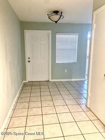 2170 Knox Mcrae Dr Unit 2, Titusville, FL 32780 - foyer with light tile patterned floors