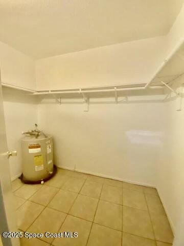 2170 Knox Mcrae Dr Unit 2, Titusville, FL 32780 - walk in closet with water heater and light tile patterned floors