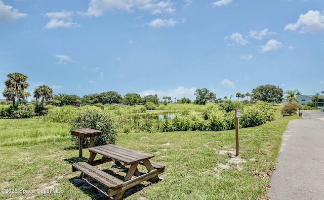 2170 Knox Mcrae Dr Unit 2, Titusville, FL 32780 - surrounding community with a water view and a lawn