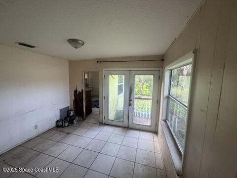 1236 Jackson St, Cocoa, FL 32922 - doorway featuring french doors and light tile patterned floors