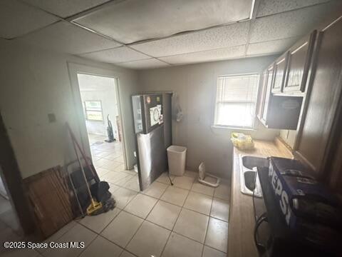 1236 Jackson St, Cocoa, FL 32922 - laundry area with light tile patterned floors