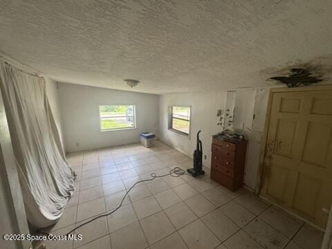 1236 Jackson St, Cocoa, FL 32922 - empty room featuring a textured ceiling and light tile patterned floors