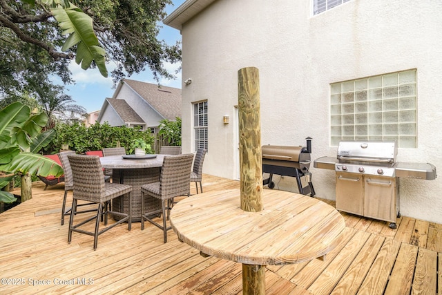 142 Ocean Garden Ln, Cape Canaveral, FL 32920 - wooden deck featuring outdoor dining space and area for grilling