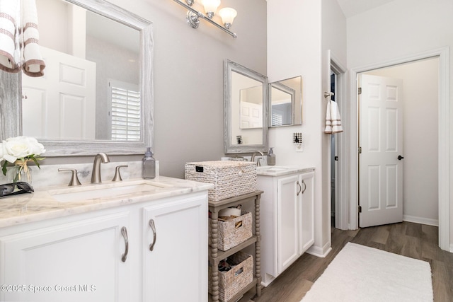 142 Ocean Garden Ln, Cape Canaveral, FL 32920 - bathroom with two vanities and wood finished floors