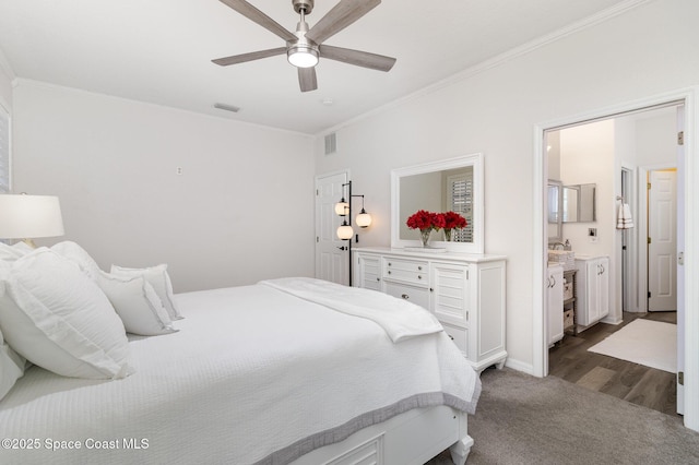 142 Ocean Garden Ln, Cape Canaveral, FL 32920 - bedroom with ornamental molding, dark colored carpet, connected bathroom, and a ceiling fan