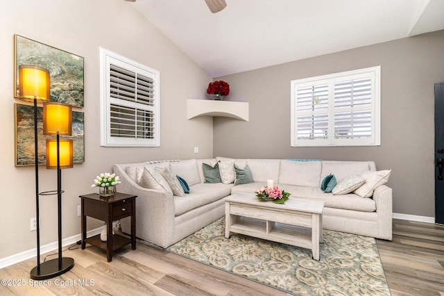 142 Ocean Garden Ln, Cape Canaveral, FL 32920 - living area with light wood finished floors, vaulted ceiling, and ceiling fan