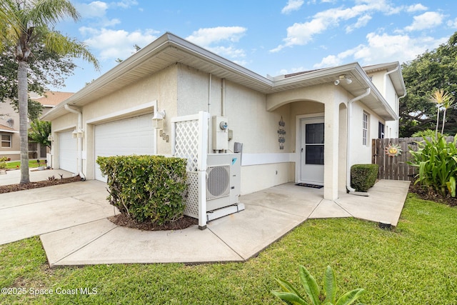 142 Ocean Garden Ln, Cape Canaveral, FL 32920 - view of front of home featuring stucco siding, an attached garage, and concrete driveway
