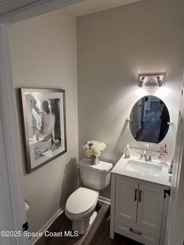 142 Ocean Garden Ln, Cape Canaveral, FL 32920 - half bath featuring vanity and wood finished floors