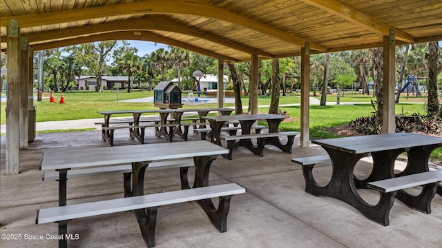 320 Cocoa Ave, Indialantic, FL 32903 - view of home's community featuring a lawn, outdoor dining space, and a patio