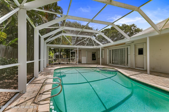 320 Cocoa Ave, Indialantic, FL 32903 - outdoor pool with a patio, glass enclosure, and an in-ground hot tub