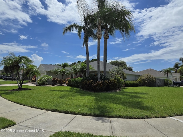 1150 Ida Way, Melbourne, FL 32940 - view of front of home with a front yard and stucco siding