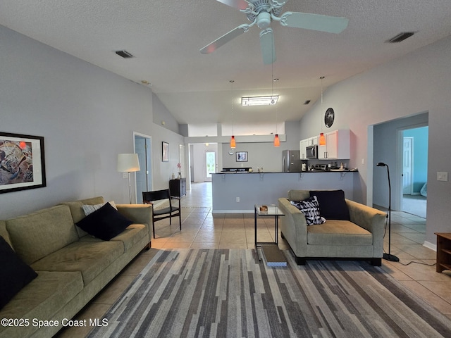 1150 Ida Way, Melbourne, FL 32940 - living area featuring light tile patterned flooring, ceiling fan, high vaulted ceiling, and a textured ceiling