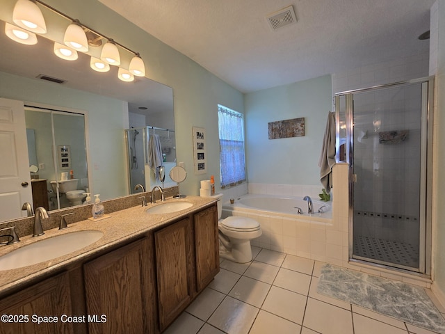 1150 Ida Way, Melbourne, FL 32940 - full bathroom with tile patterned floors, a garden tub, a shower stall, and double vanity