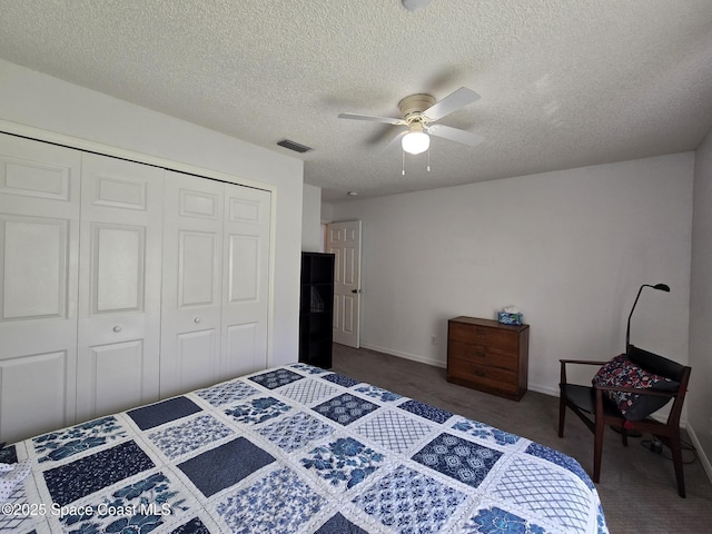 1150 Ida Way, Melbourne, FL 32940 - bedroom with a closet, a textured ceiling, dark carpet, and a ceiling fan
