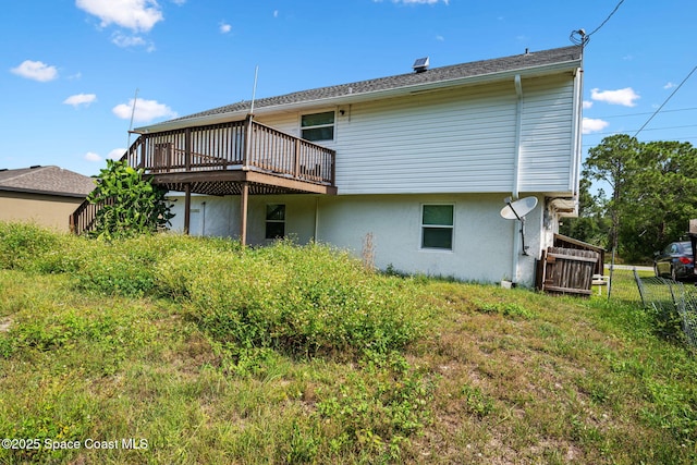 1620 Wichita Blvd SE, Palm Bay, FL 32909 - rear view of property with a wooden deck and stucco siding