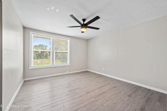 1620 Wichita Blvd SE, Palm Bay, FL 32909 - empty room featuring wood finished floors, ceiling fan, a textured ceiling, and baseboards