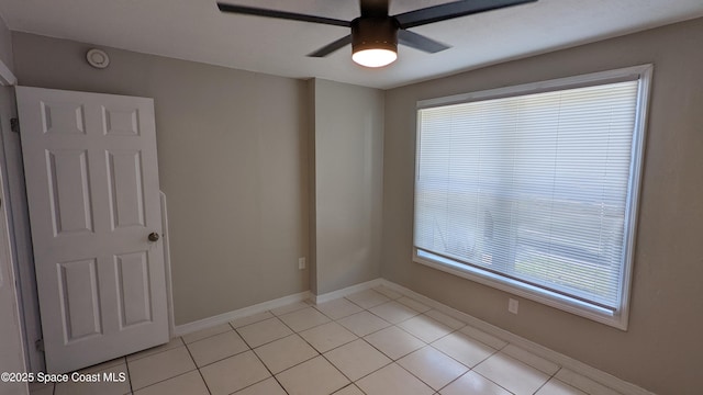 1620 Wichita Blvd SE, Palm Bay, FL 32909 - empty room featuring light tile patterned floors, ceiling fan, baseboards, and a smoke detector