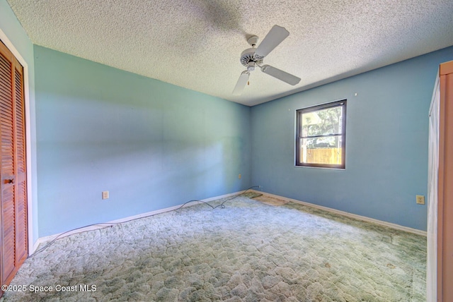 5320 Shadwell Ave, Cocoa, FL 32926 - unfurnished bedroom featuring carpet, a closet, a textured ceiling, and ceiling fan
