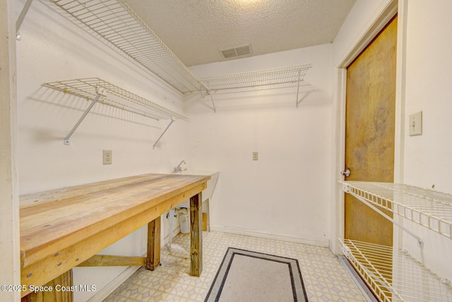 5320 Shadwell Ave, Cocoa, FL 32926 - spacious closet featuring tile patterned floors and a workshop area
