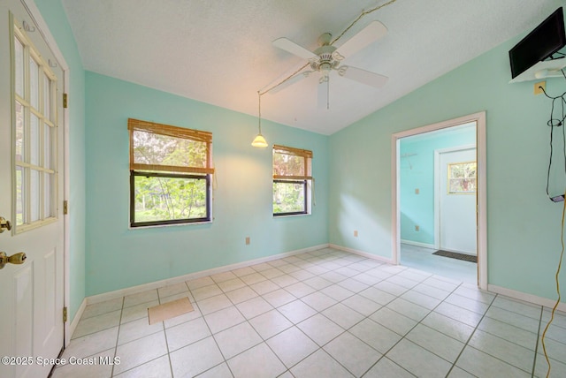 5320 Shadwell Ave, Cocoa, FL 32926 - unfurnished room with vaulted ceiling, a ceiling fan, and light tile patterned flooring