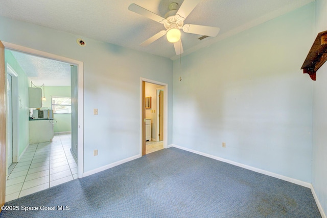 5320 Shadwell Ave, Cocoa, FL 32926 - unfurnished bedroom with carpet, ceiling fan, and tile patterned flooring