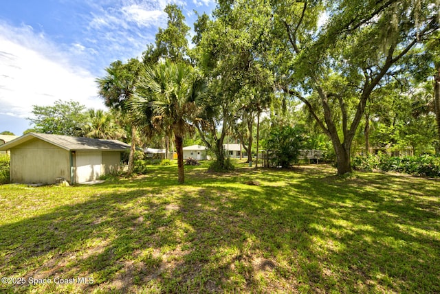 5320 Shadwell Ave, Cocoa, FL 32926 - view of green lawn with an outbuilding