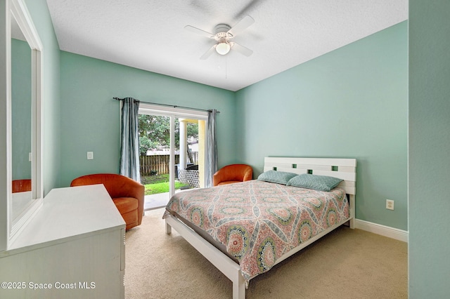 2178 Tanager Ct, Melbourne, FL 32903 - carpeted bedroom featuring access to exterior, ceiling fan, and baseboards