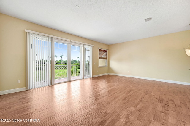 2178 Tanager Ct, Melbourne, FL 32903 - empty room featuring baseboards and light wood-style floors