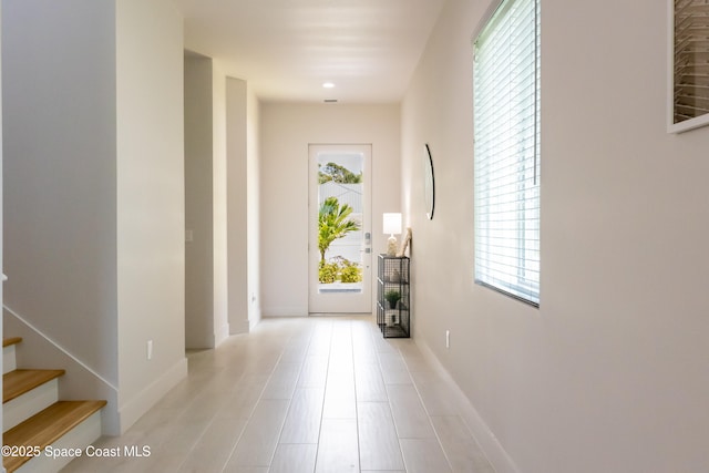 2148 Country Club Rd, Melbourne, FL 32901 - foyer with healthy amount of natural light, baseboards, and stairs