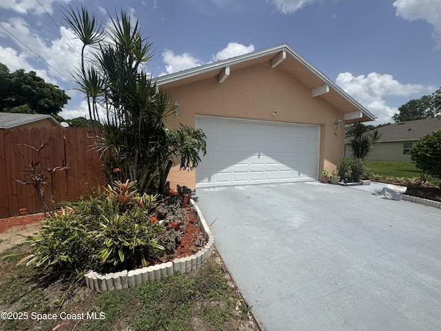 1637 Kanabec Ave NW, Palm Bay, FL 32907 - view of front of property with driveway, stucco siding, and an attached garage