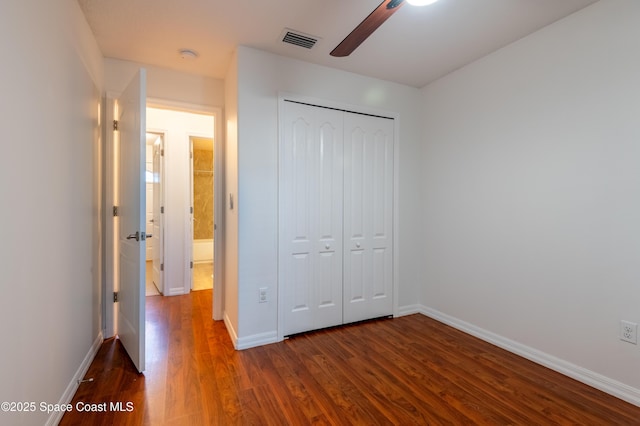 4180 Seville Ave, Cocoa, FL 32926 - unfurnished bedroom featuring dark wood-style flooring, a closet, and ceiling fan