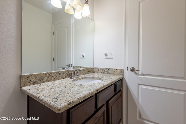 4180 Seville Ave, Cocoa, FL 32926 - bathroom featuring vanity and a chandelier