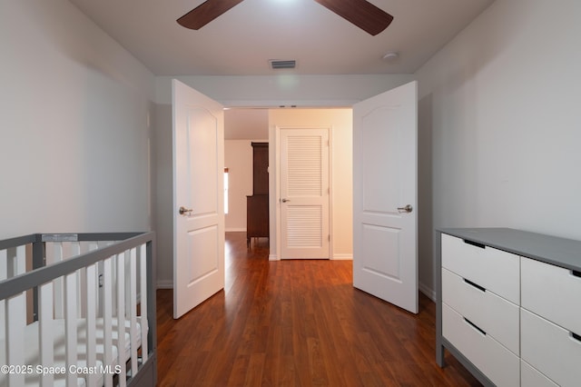 4180 Seville Ave, Cocoa, FL 32926 - unfurnished bedroom featuring dark wood finished floors and a ceiling fan