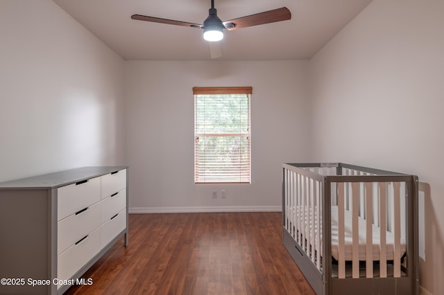 4180 Seville Ave, Cocoa, FL 32926 - unfurnished bedroom with wood finished floors, ceiling fan, and a nursery area