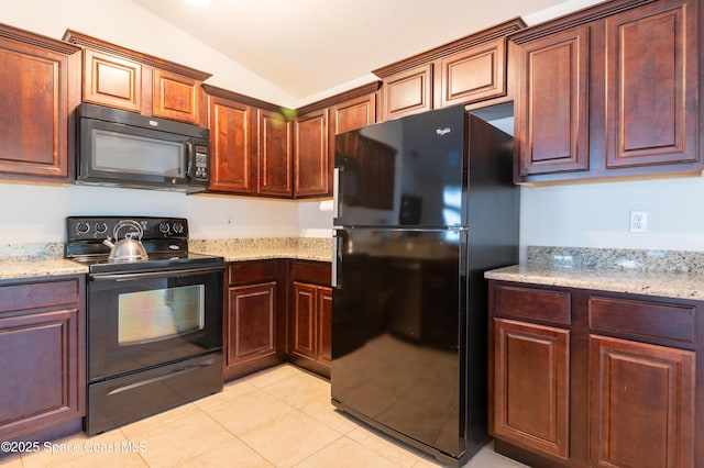 4180 Seville Ave, Cocoa, FL 32926 - kitchen with black appliances, lofted ceiling, light tile patterned floors, and light stone countertops