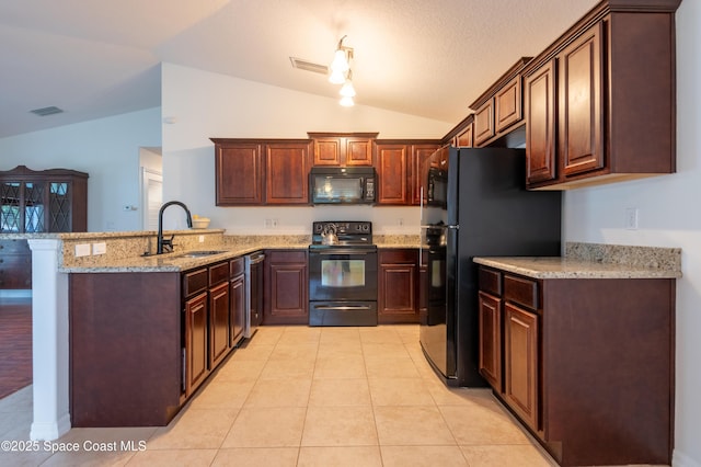 4180 Seville Ave, Cocoa, FL 32926 - kitchen with black appliances, lofted ceiling, a peninsula, light stone countertops, and light tile patterned flooring