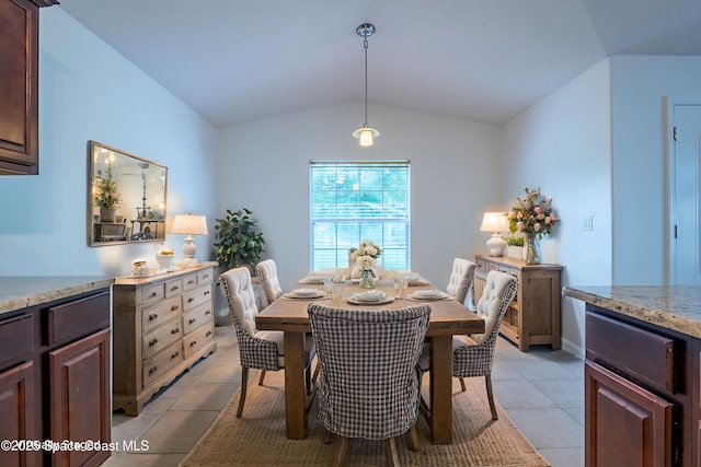 4180 Seville Ave, Cocoa, FL 32926 - dining space with light tile patterned flooring and lofted ceiling