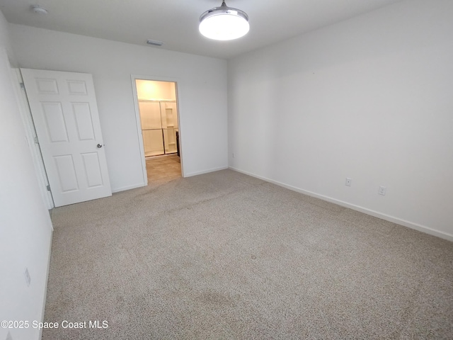 565 Sorrento Dr, Cocoa, FL 32922 - unfurnished bedroom featuring carpet and baseboards