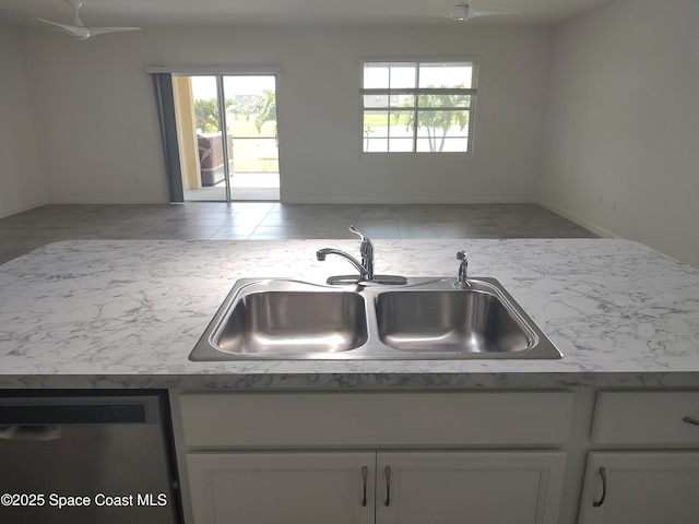 565 Sorrento Dr, Cocoa, FL 32922 - kitchen featuring a sink, dishwasher, and healthy amount of natural light