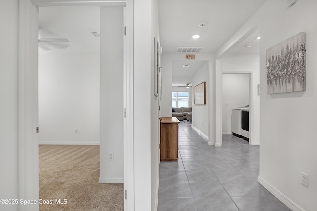 1265 Valley View Ave, Rockledge, FL 32955 - corridor with light tile patterned floors, recessed lighting, and washer / dryer