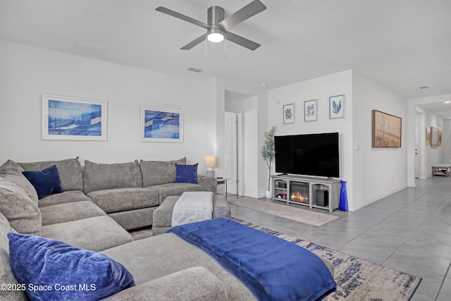 1265 Valley View Ave, Rockledge, FL 32955 - living area featuring a ceiling fan and a glass covered fireplace