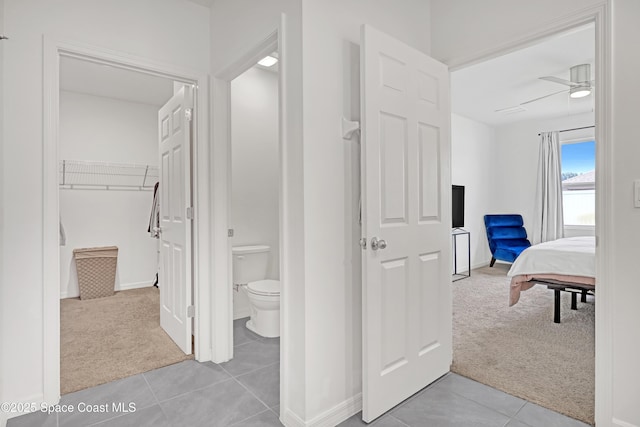 1265 Valley View Ave, Rockledge, FL 32955 - corridor with light colored carpet and light tile patterned floors