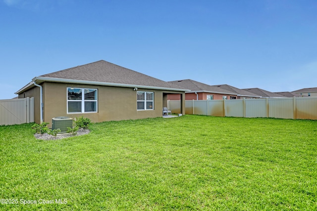 1265 Valley View Ave, Rockledge, FL 32955 - back of property featuring a fenced backyard, stucco siding, and roof with shingles