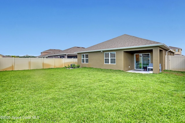 1265 Valley View Ave, Rockledge, FL 32955 - rear view of house with stucco siding, a fenced backyard, a patio, and a shingled roof