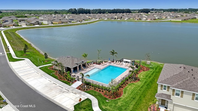 1265 Valley View Ave, Rockledge, FL 32955 - aerial perspective of suburban area featuring a pool area and a nearby body of water